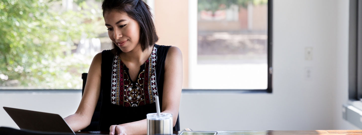 Woman works on her laptop
